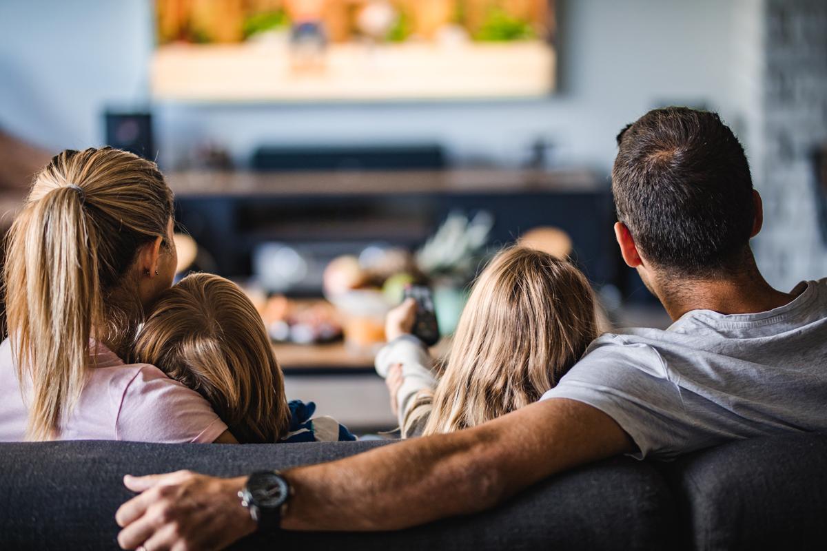 Family watching TV.